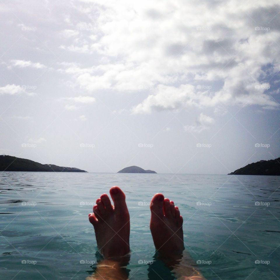 Feet floating in the Caribbean