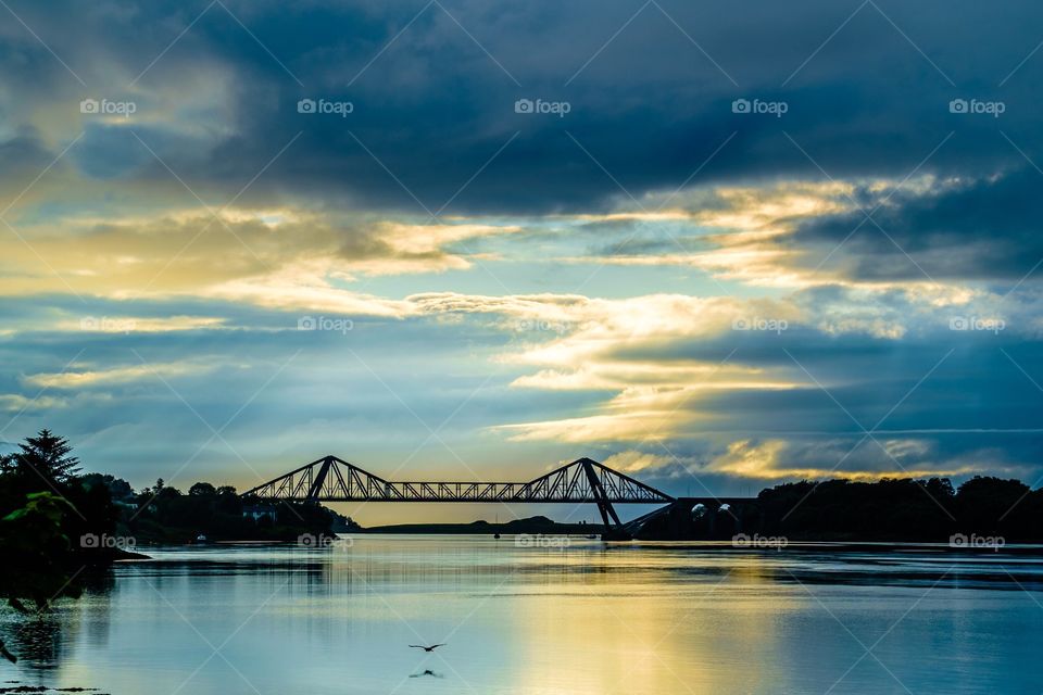 Connel Bridge Sunset . Sunset Silhouette of Connel Bridge at Connel, near Oban on the Atlantic west coast of Scotland with blues and gold.