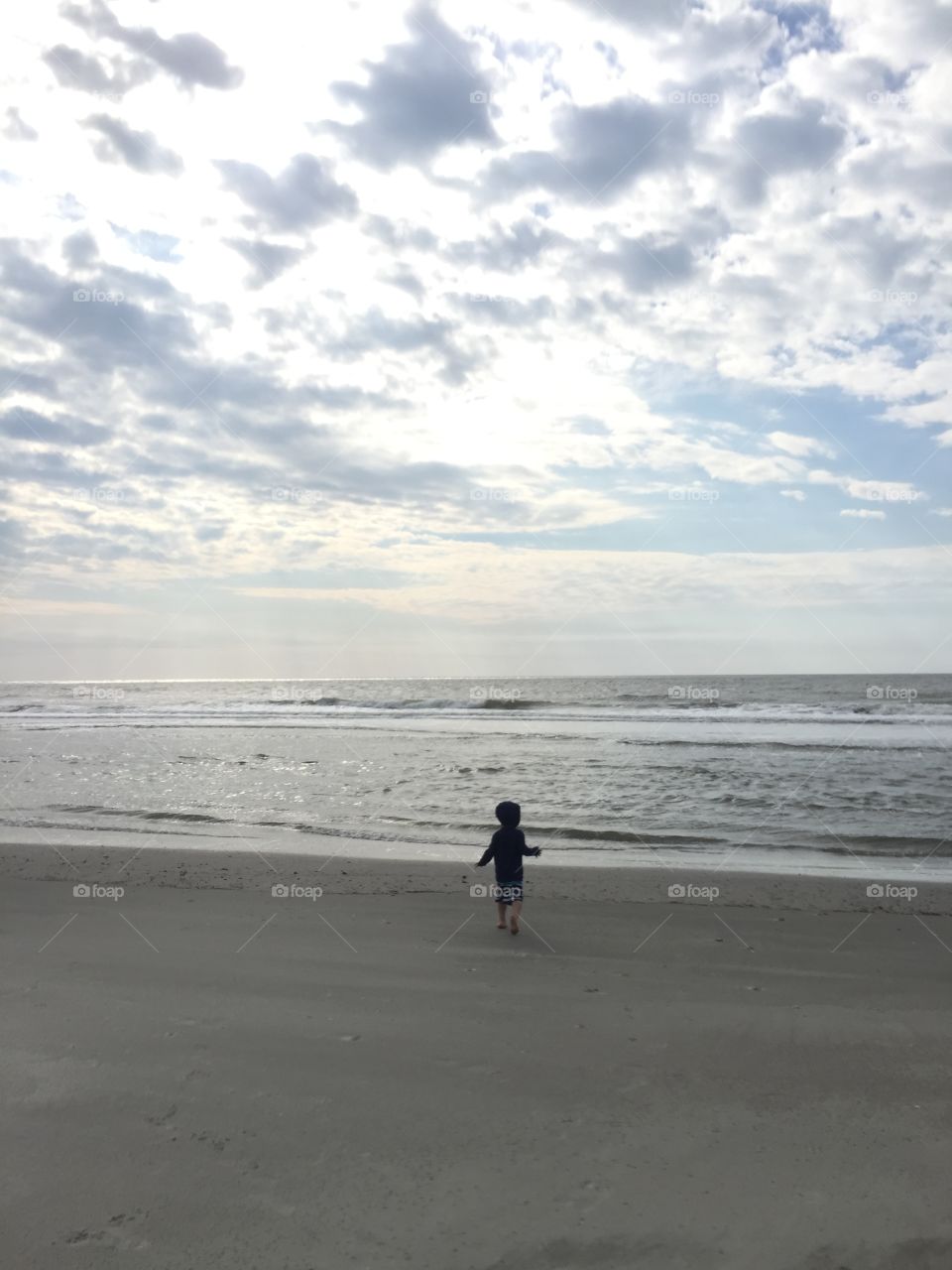 Child running on the beach