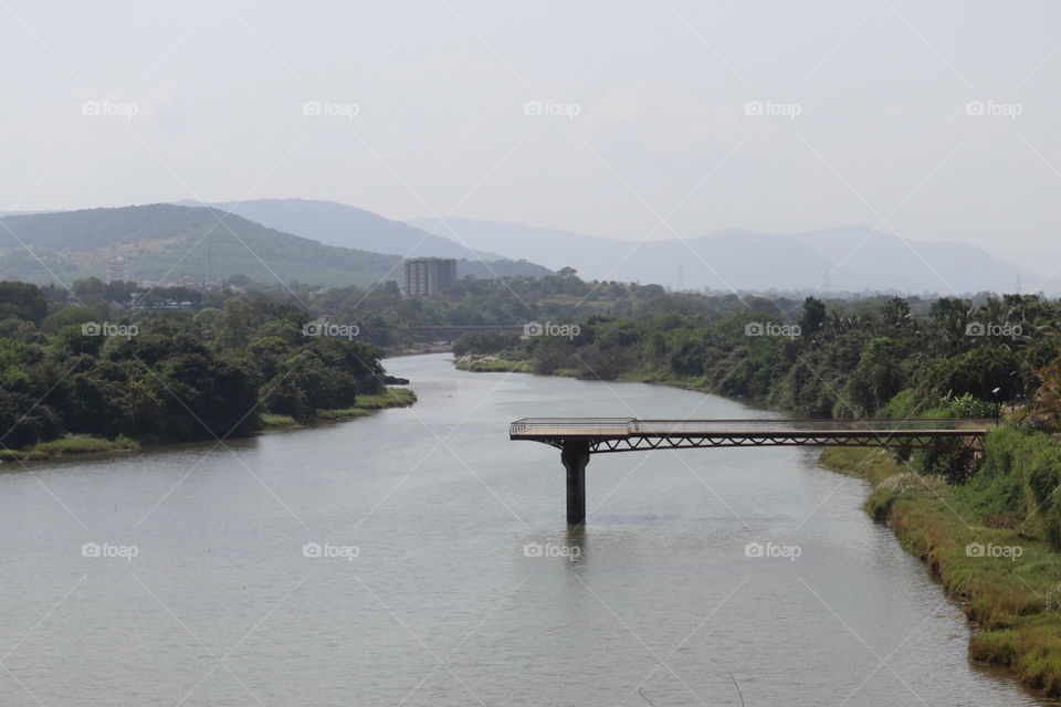 Deck in river. Deck constructed with bridge.