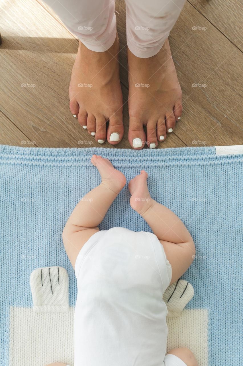 beautiful mother and six-month-old son, tender family photos, family spending time at home