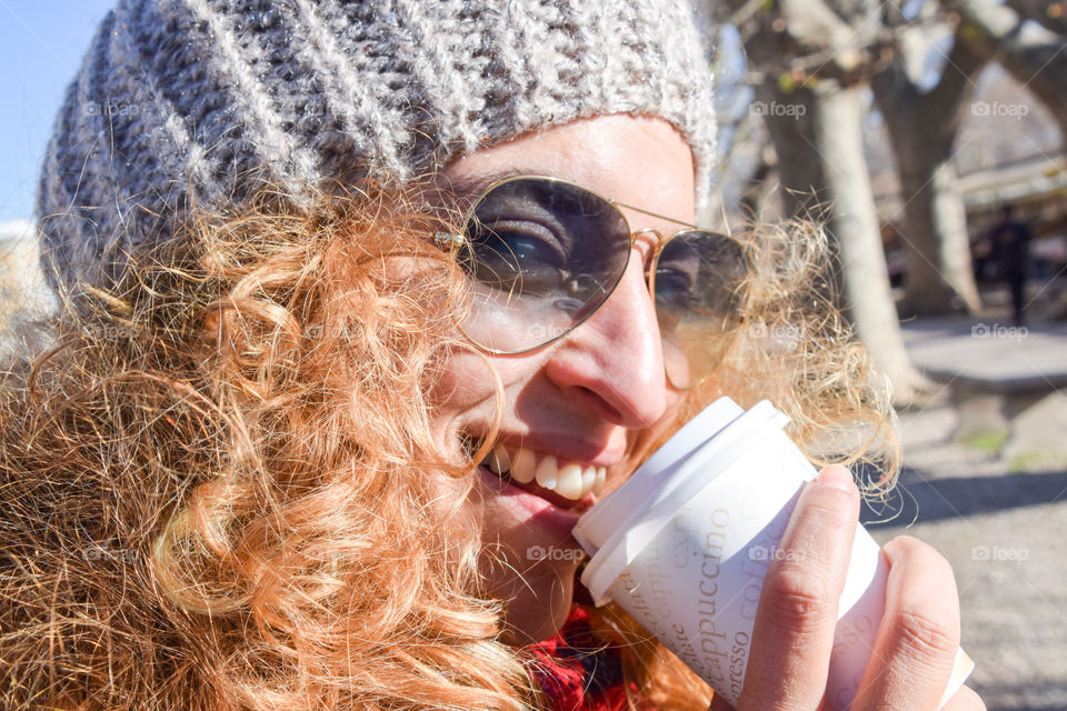 Beautiful Happy Smiling Blonde Young Woman Drinking Coffee In The Street
