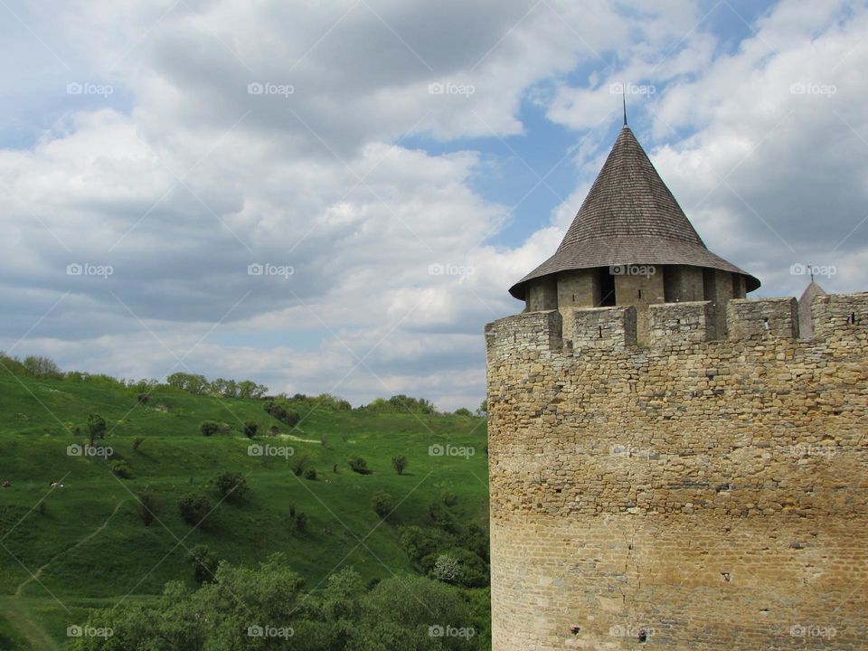 Fortress on the background of green hill