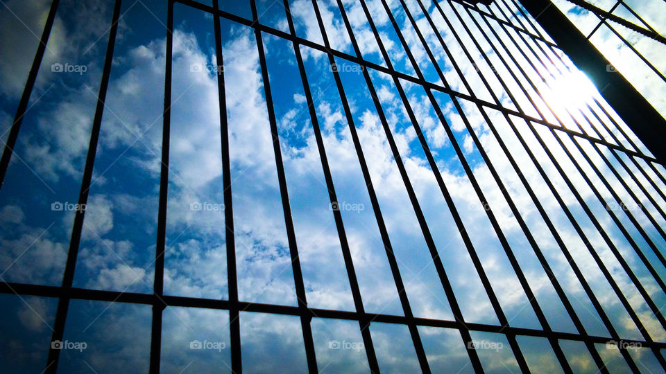 cloud and sky through silhouette window frame