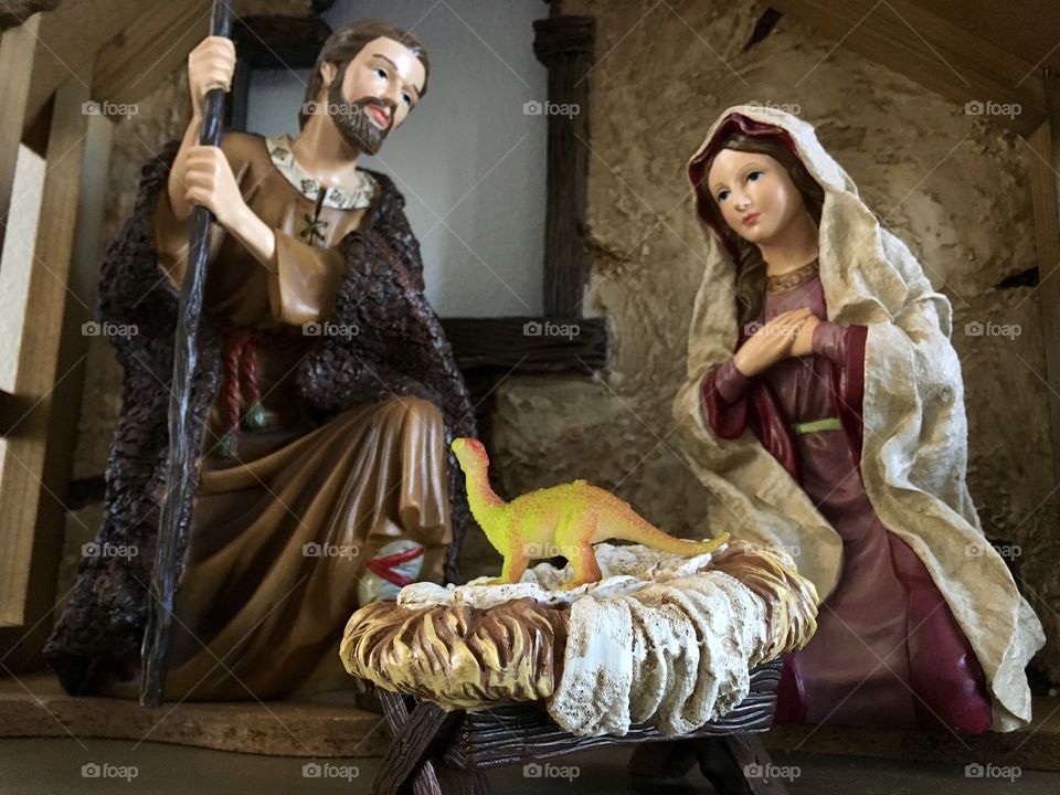 Baby jesus dinosaur in manger with mary and joseph nativity