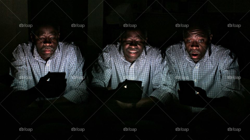 African man using smartphone