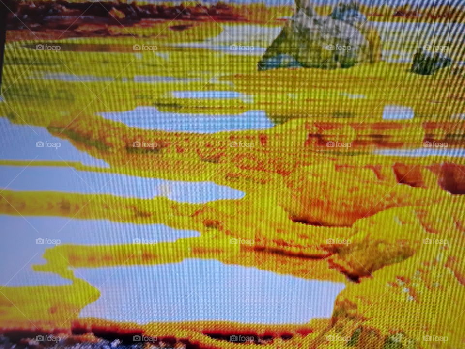 In this photo, nature shows once again its strength with natural pools and these beautiful yellow rocks