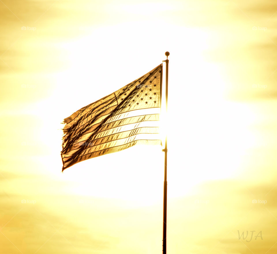 United States flag caught in a sunset. 