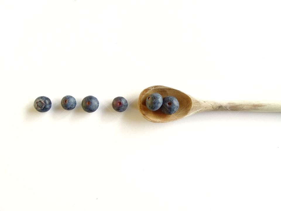 Blueberries on a wooden spoon