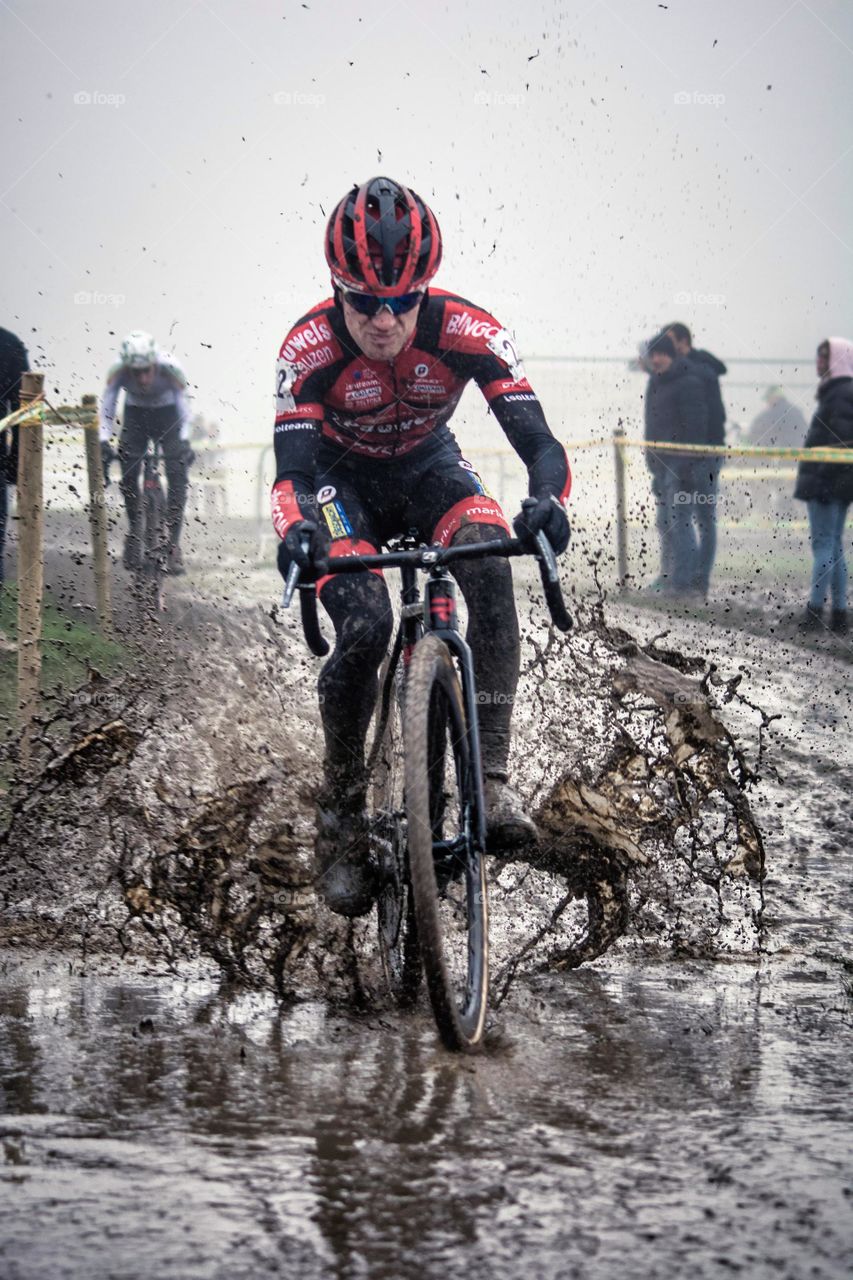 Bicycle Rider Splashes Rain Water While Riding