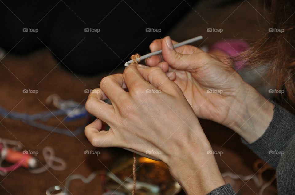 hands knitting something