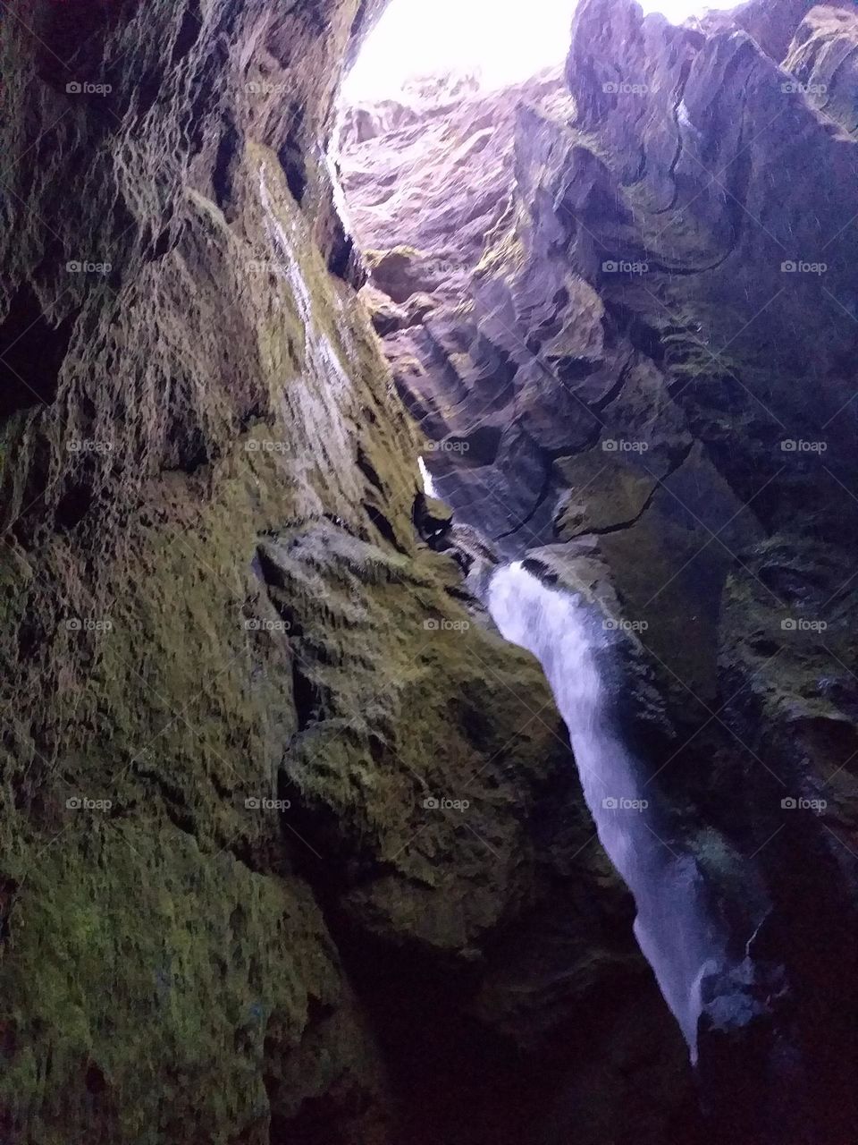 power of nature. waterfall through the mountain