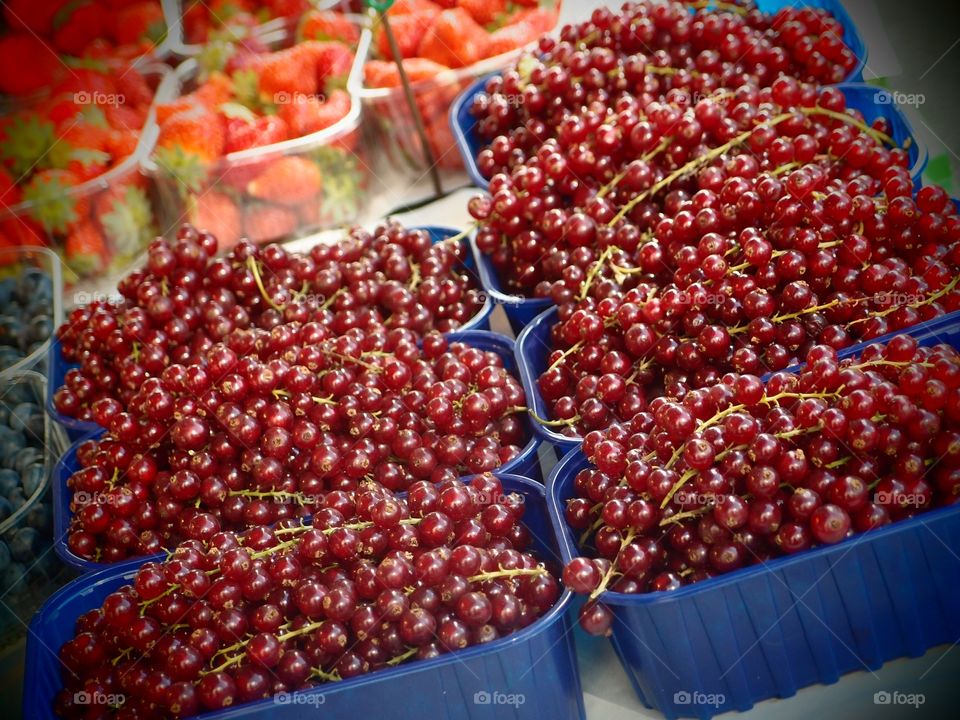 Berries. fruits on display in a day market in old towm part of Geneve