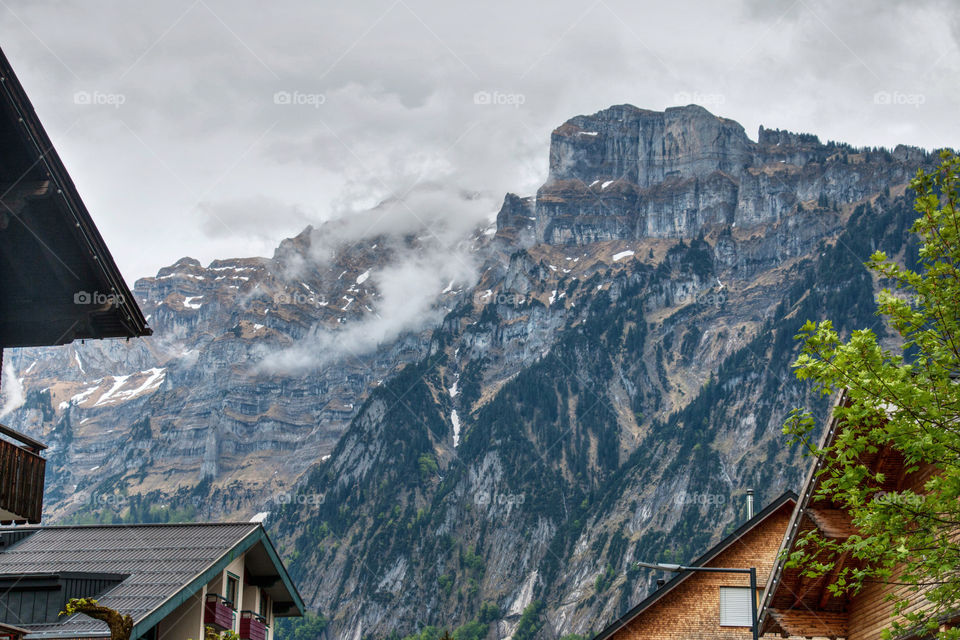 Scenic view of a mountains against cloudy sky