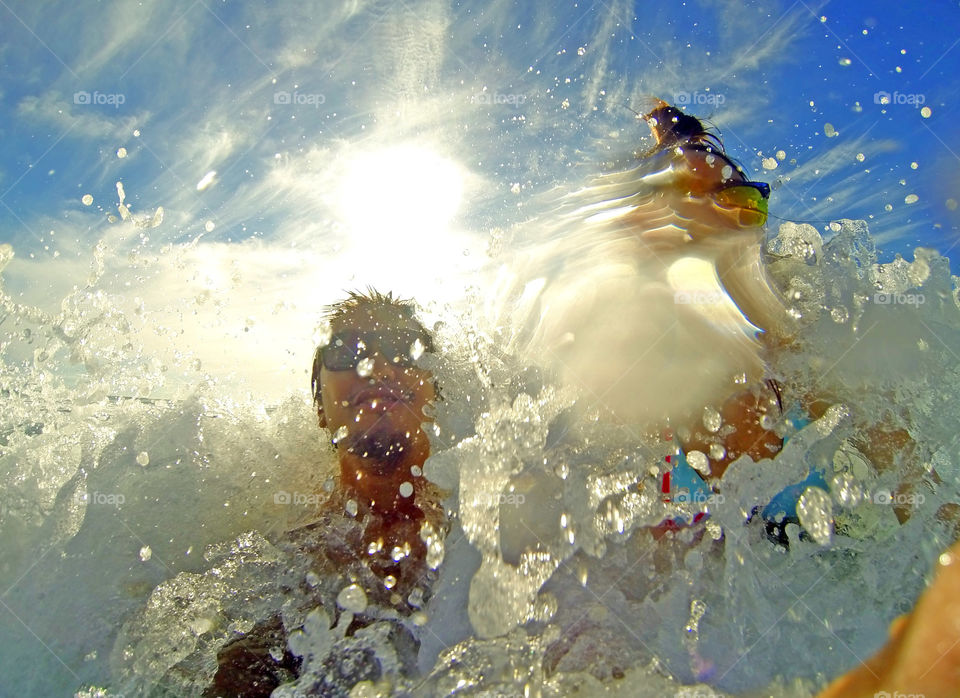 Fun beach swimming chasing the waves