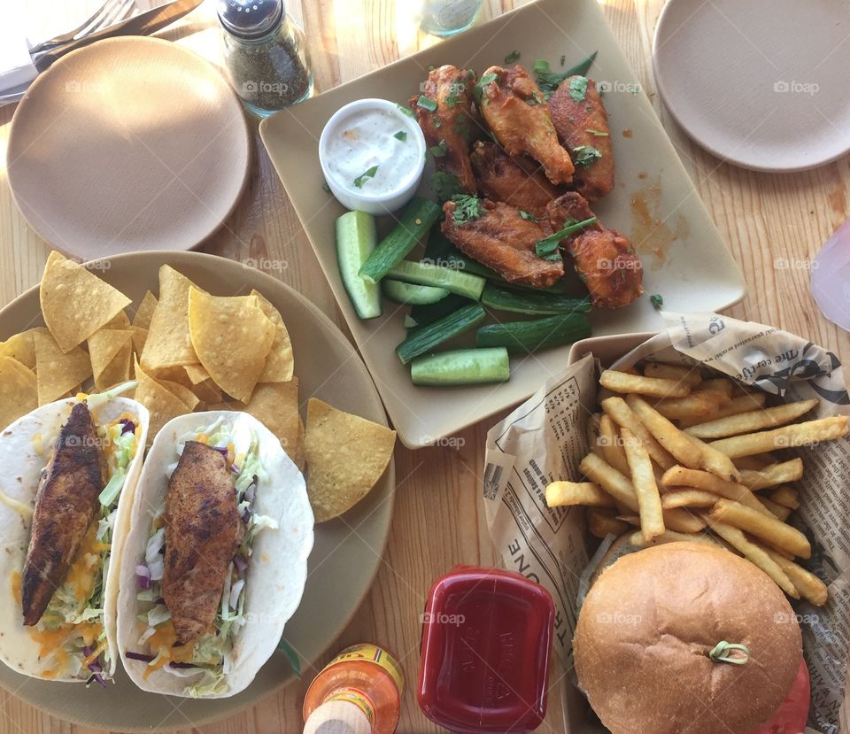 Food feast!
Burger, fries, nachos, chicken wings etc. 