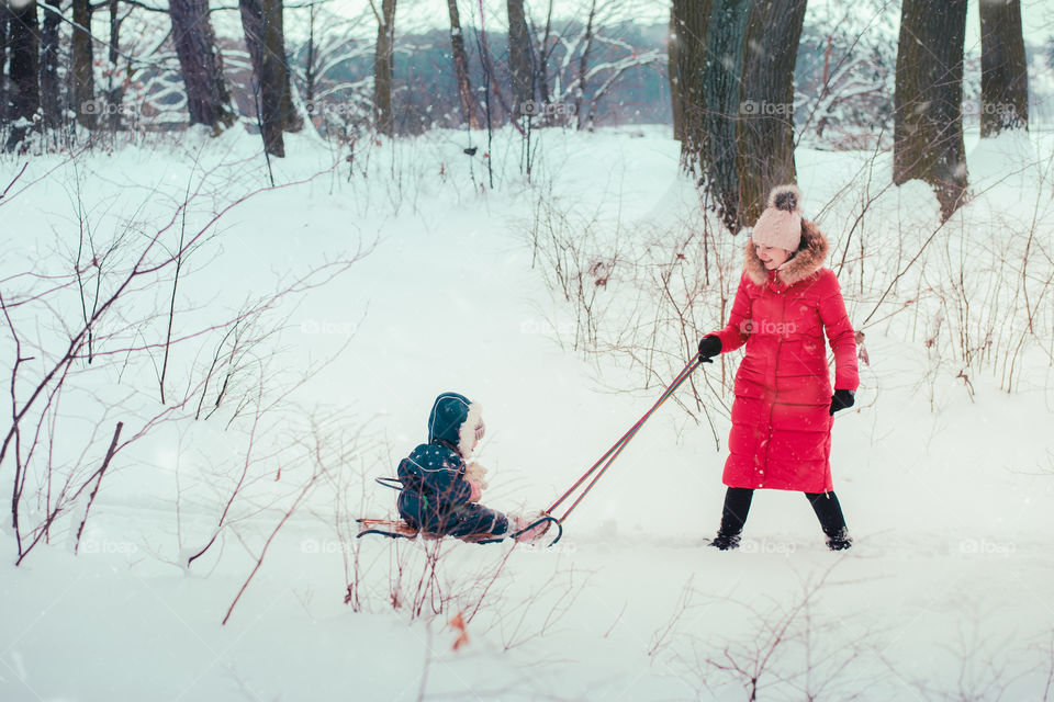 Winter with friends. Spending wintertime outdoors playing with snow