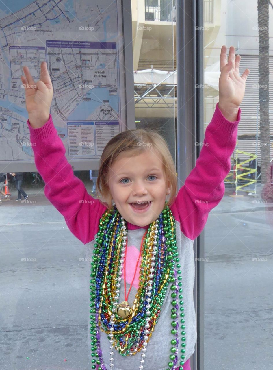 3 year old in New Orleans with beads