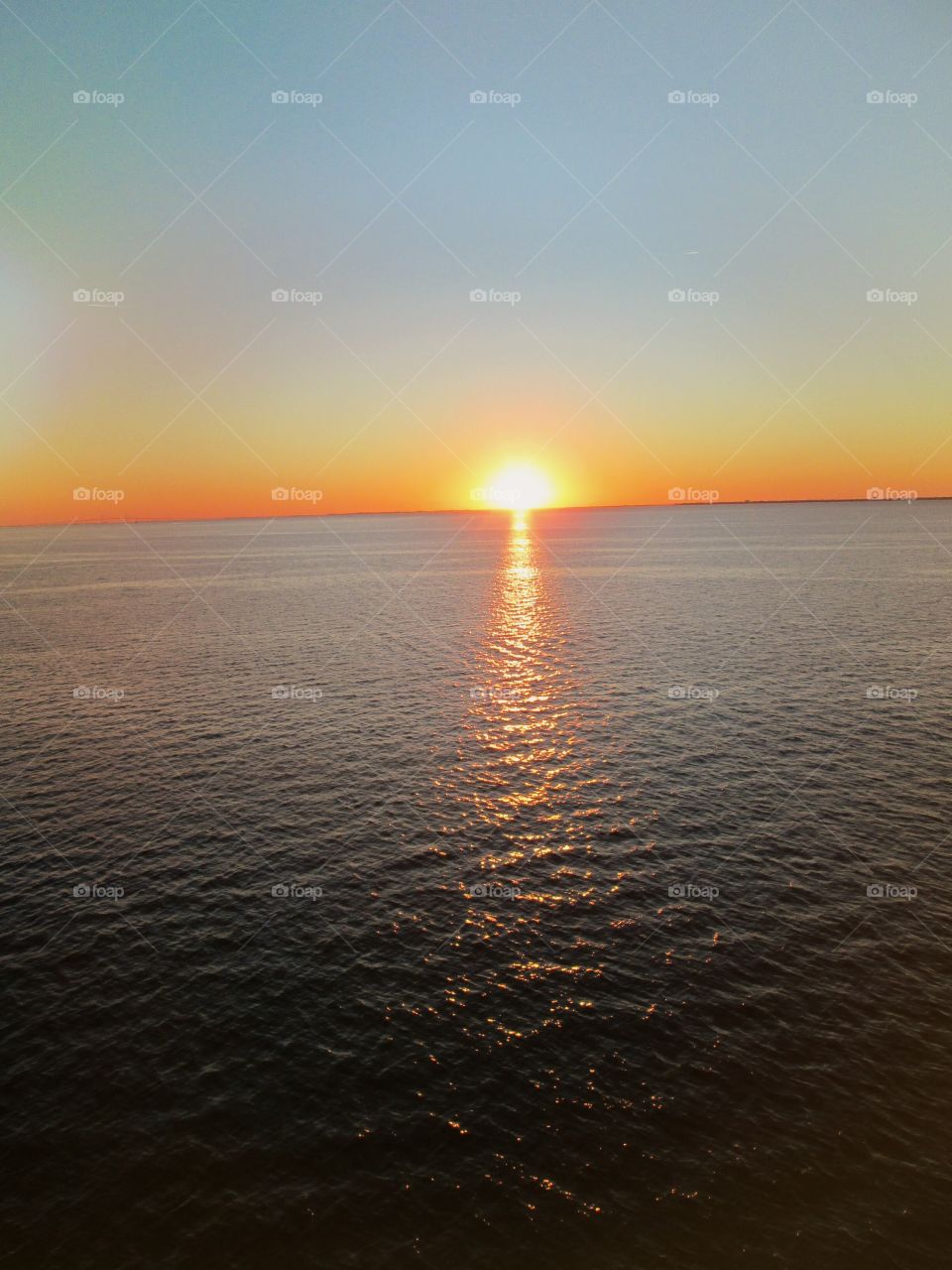 mid ocean view horizon sunset from cruise ship balcony