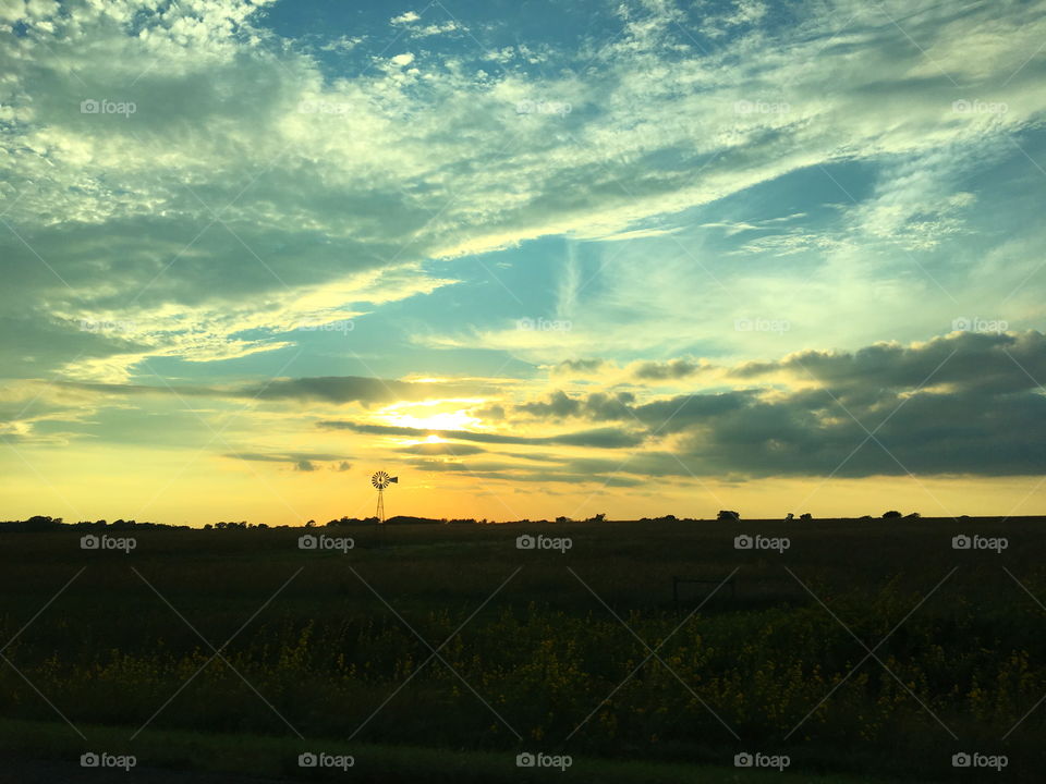 Kansas Sunset with a Windmill in the background 