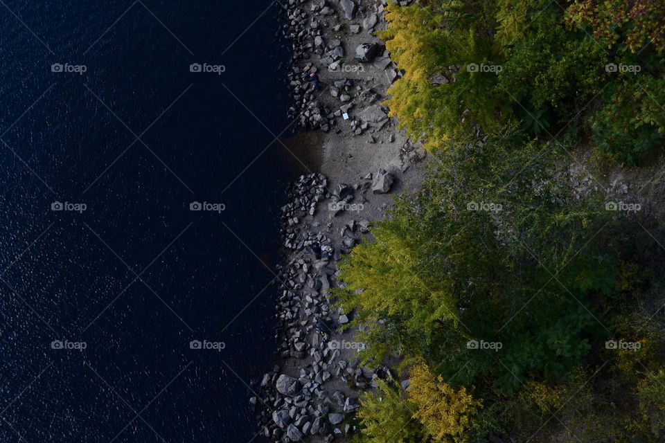 Rocky river bank in autumn.