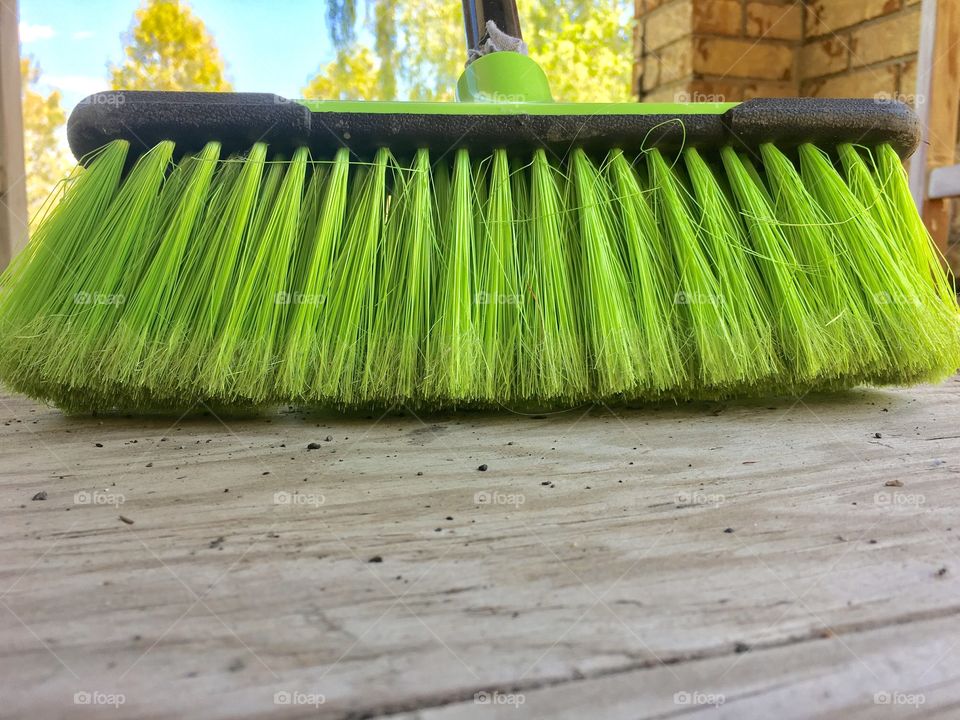 Close-up of a green broom plastic