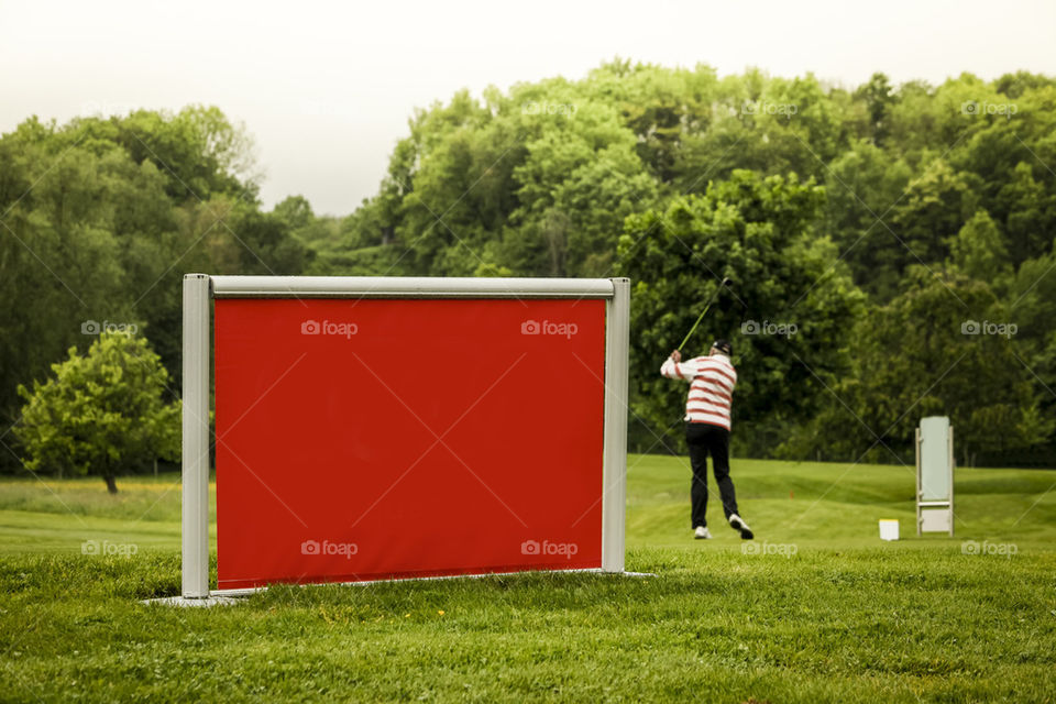 Red Sign and golf player