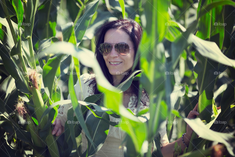 Portrait of a woman in corn field