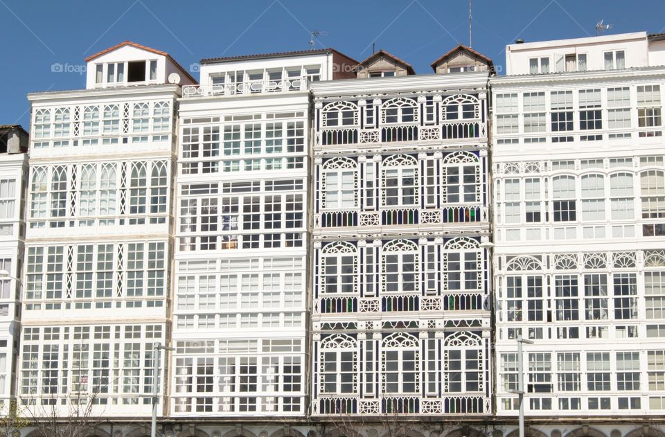 Glazed balconies on waterfront, A Coruña, Galicia, Spain.