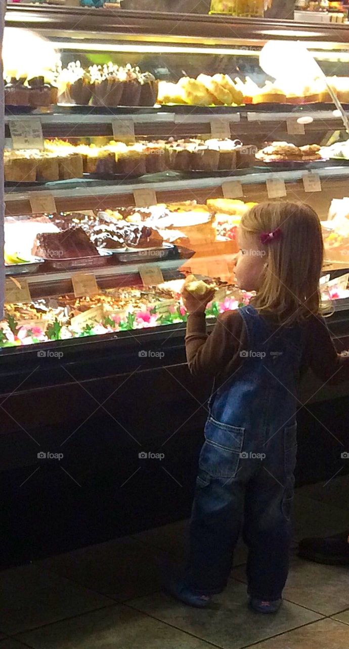 Girl looking at Dessert Display