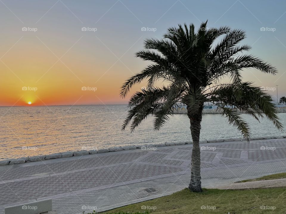 Golden sun set from a sea front