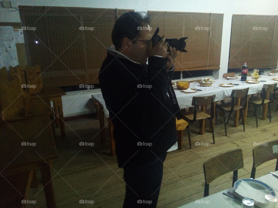 Photographer capturing picture in restaurant