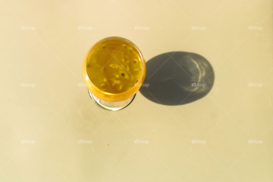 outline of a glass of passion fruit juice with shadow effect. Shadow effect of passion fruit juice. Amazing photography of shadow effect