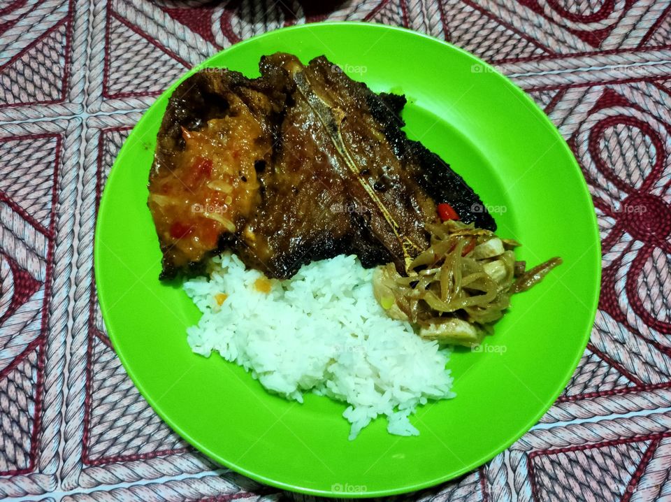 rice mixed with roasted goat and vegetables