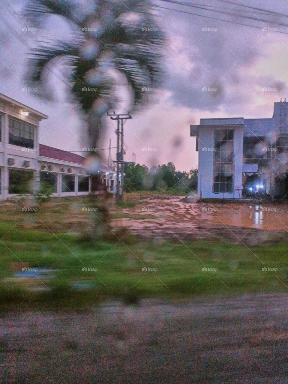 Selective focus on the rain drops on the windshield of the car. After rain at the rainy season