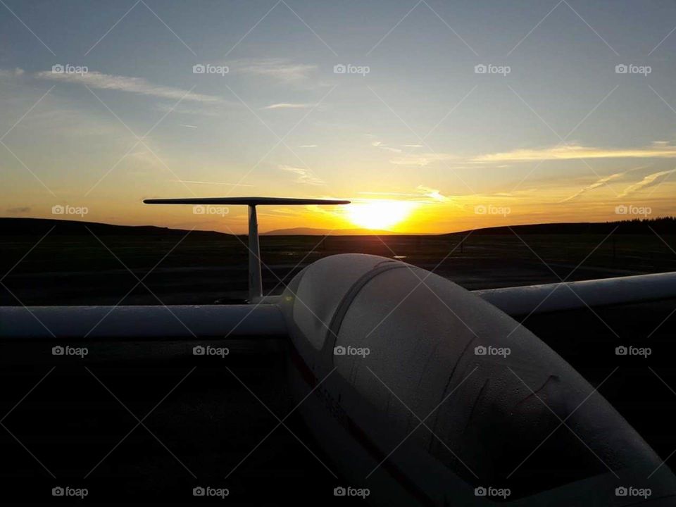 Sunrise over aircraft at Long Mynd