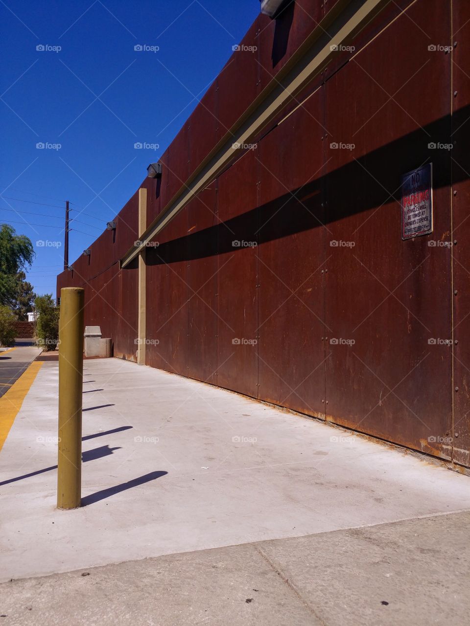 Long curving iron rust wall Scottsdale Arizona