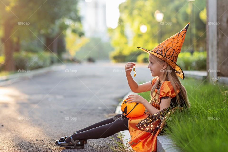 Happy kid celebrating Halloween outdoor 