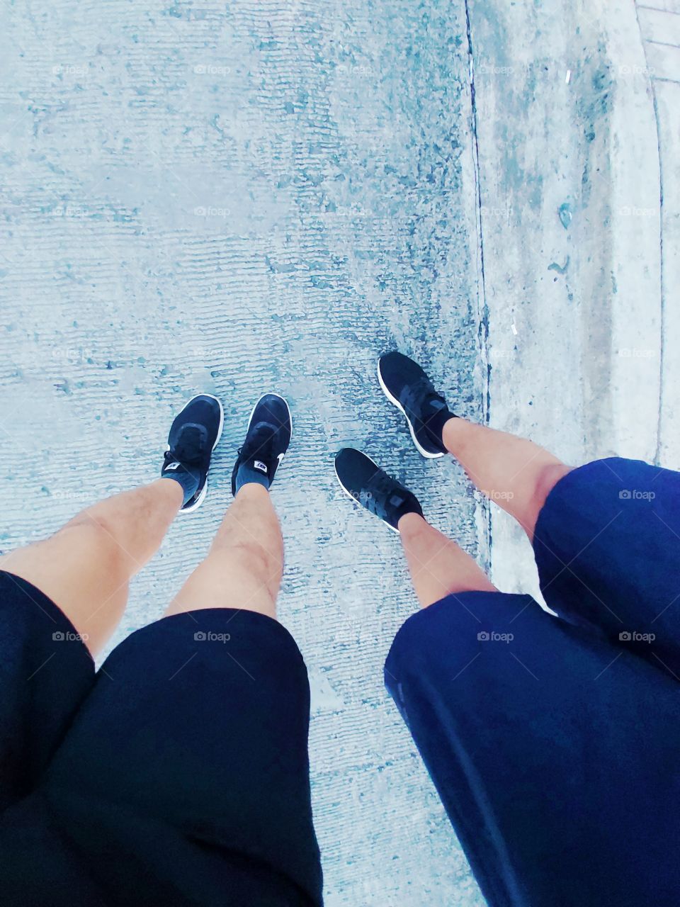 Two friends on their sneakers and ready to jog