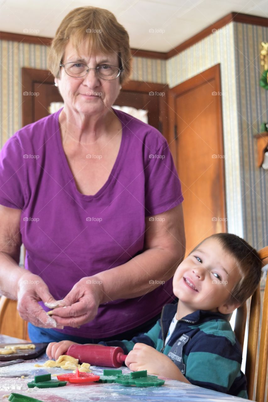 Grandmother helping to bake cookies