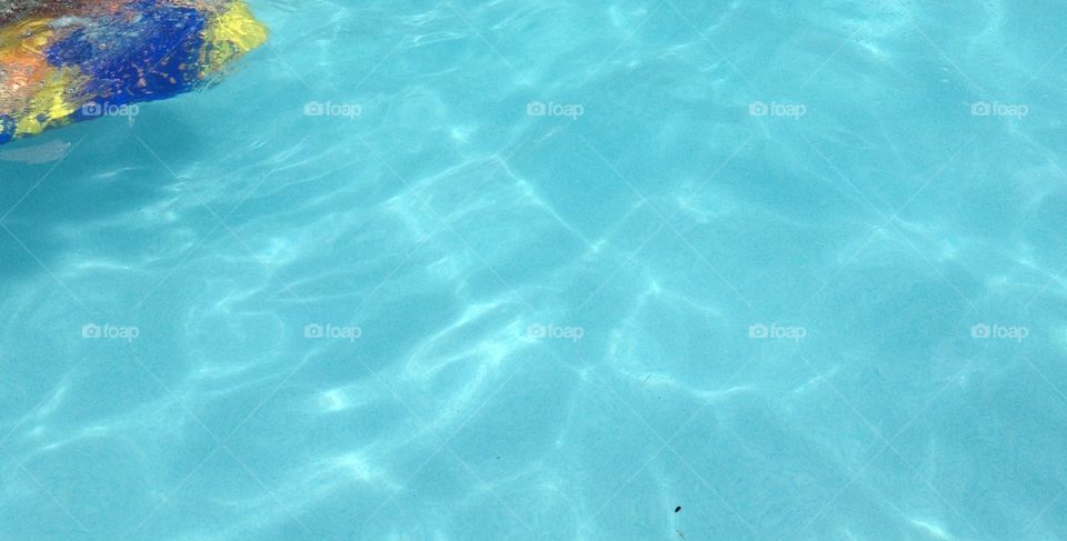 Floatie in blue pool