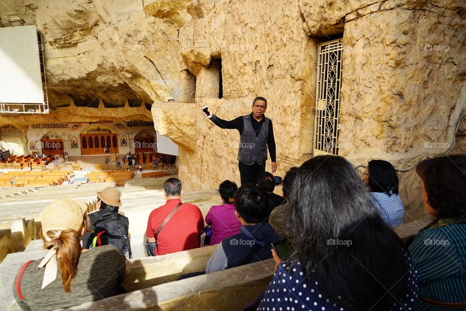 a sermon for group of tourists in the Church of Simon the Tanner in Cairo of Egypt
