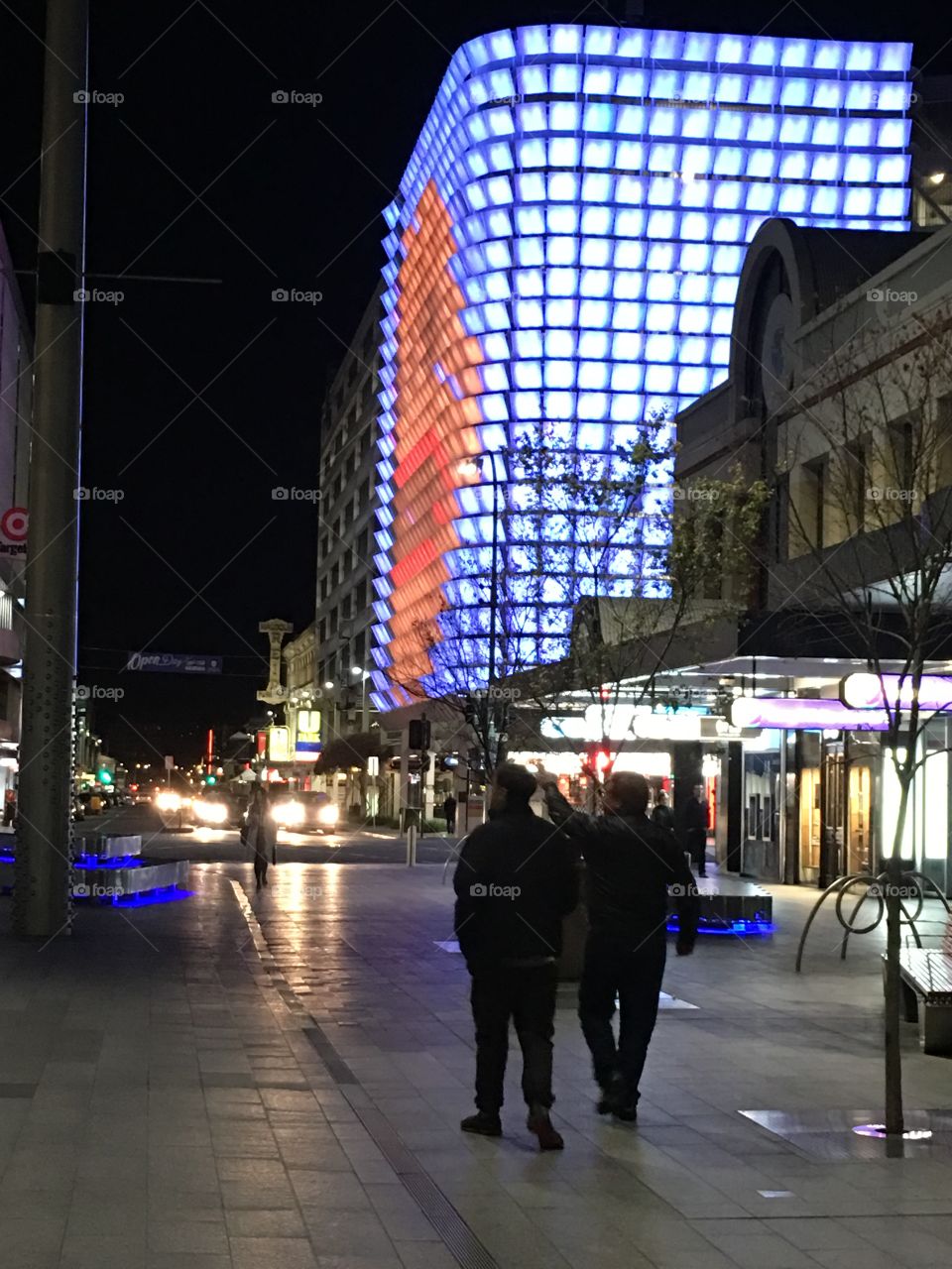 Neon city lights rundell mall Adelaide people walking near building lit up with neon lights mosaic 