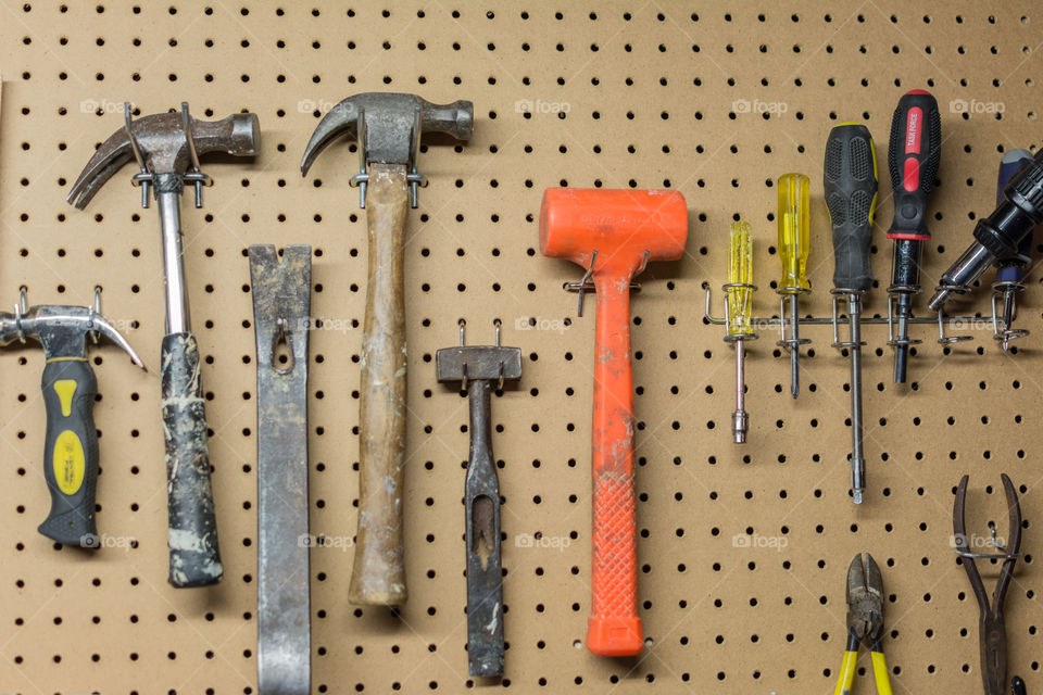 Handtools hanging on a peg board