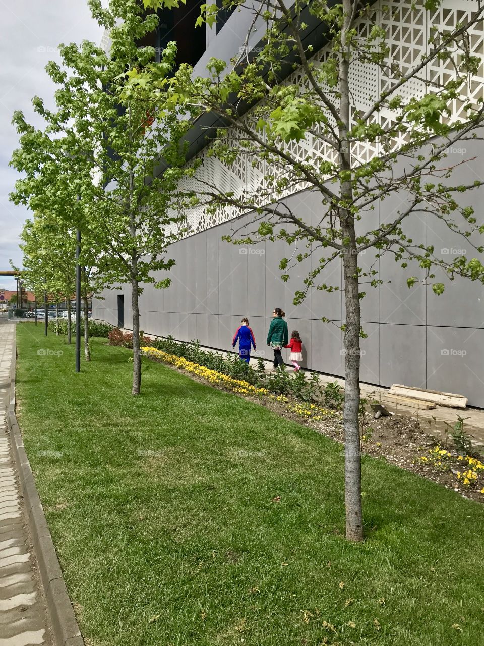 Mother and kids walking.