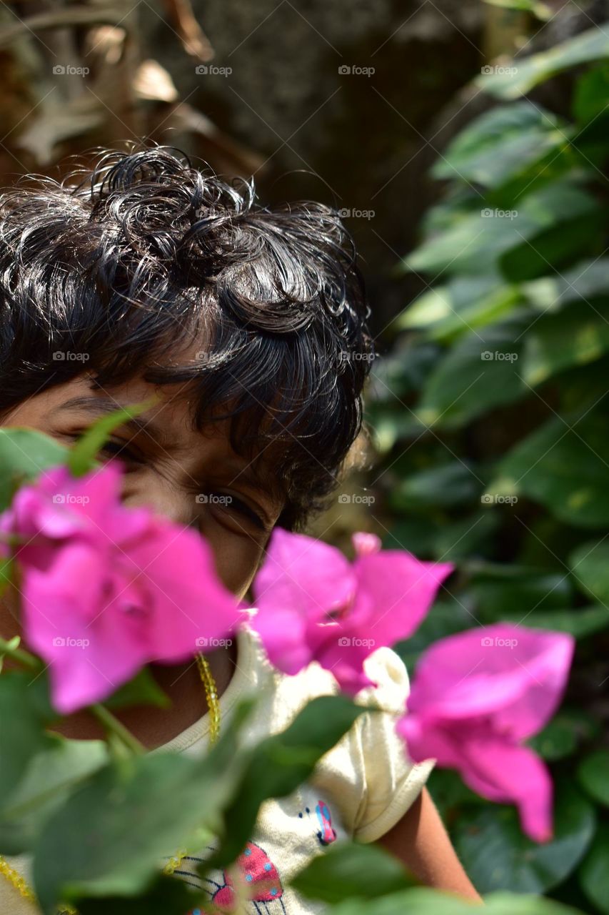 kid posing and playing in the garden