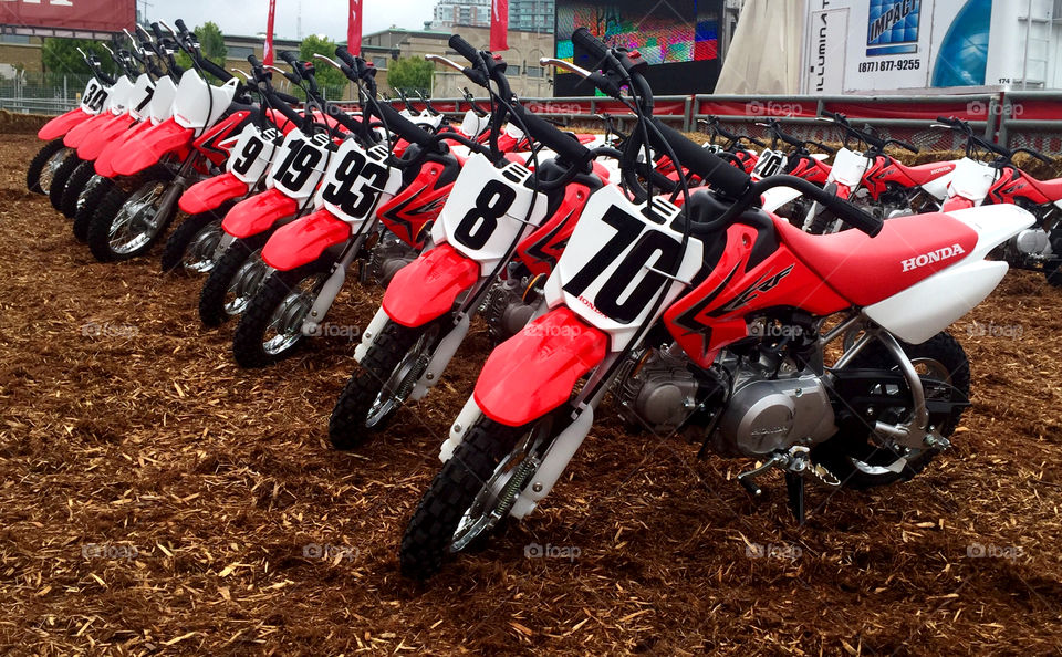 Dirt bikes lined up in row (Honda)
