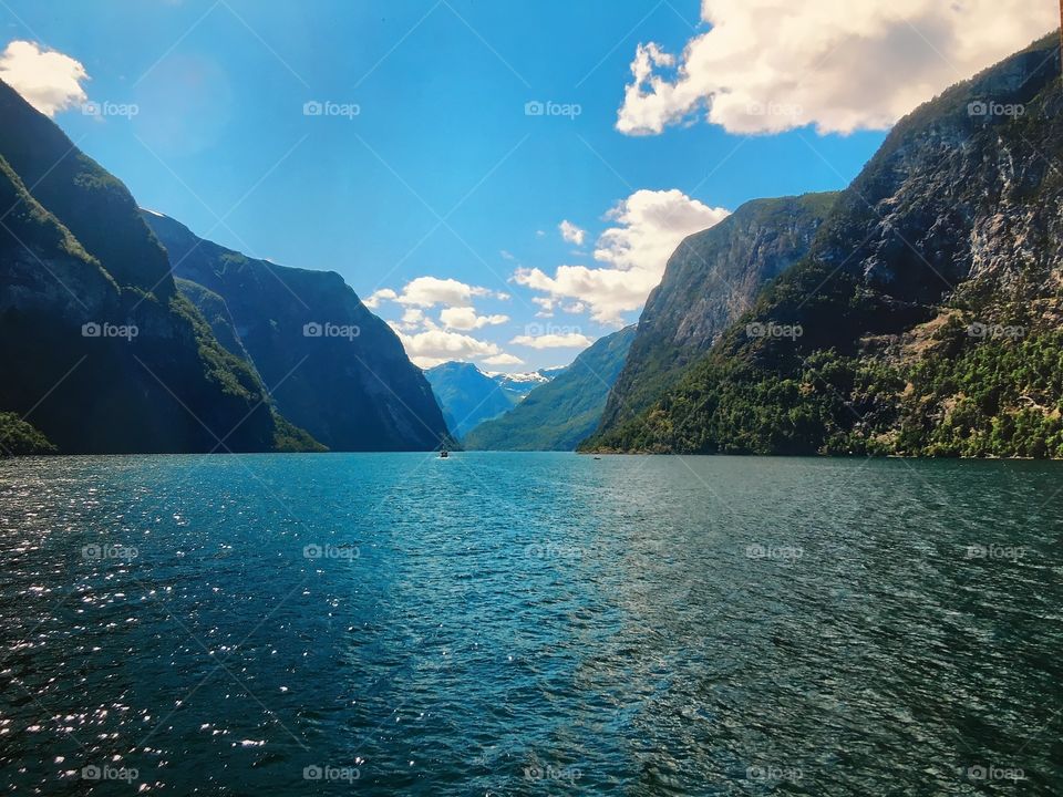 Incredible scenic view of the fjords from a river in Western Norway on a partly sunny, beautiful day. This is my favorite photo from one of my best travel experiences. 