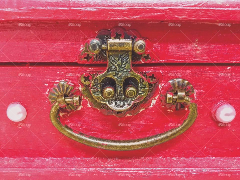 Details of an old red wooden box