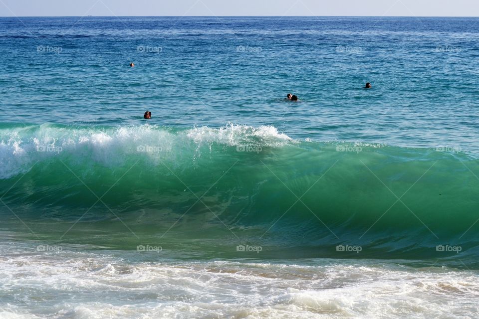 Big wave breaking against the shore